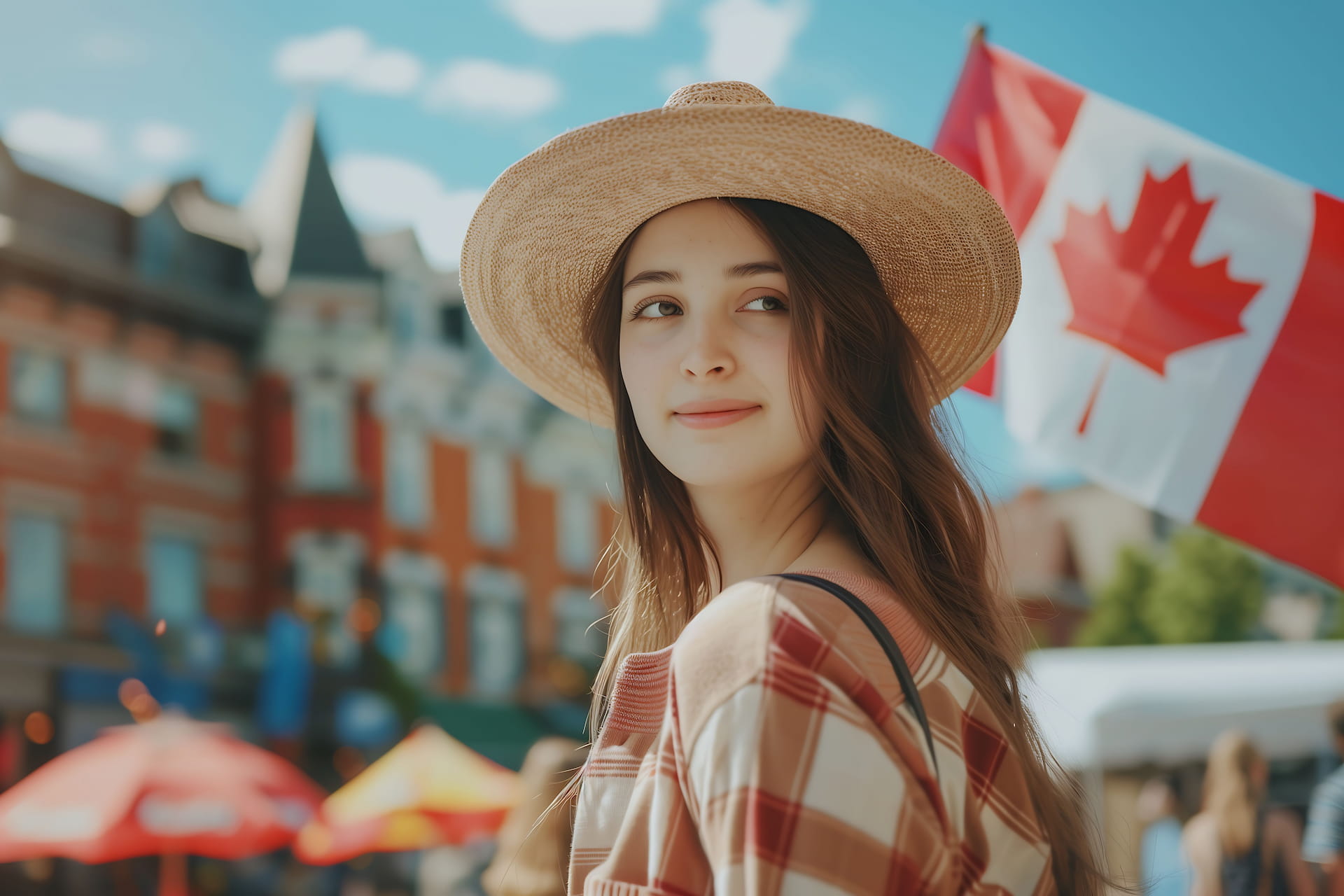 Smiling woman in a straw hat with a Canadian flag in the background, evoking Canadian pride.